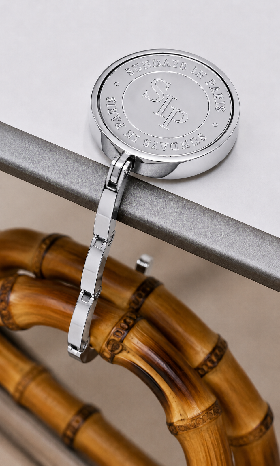 Silver Le Petite purse hook by Sundays in Paris, a slim portable table hook